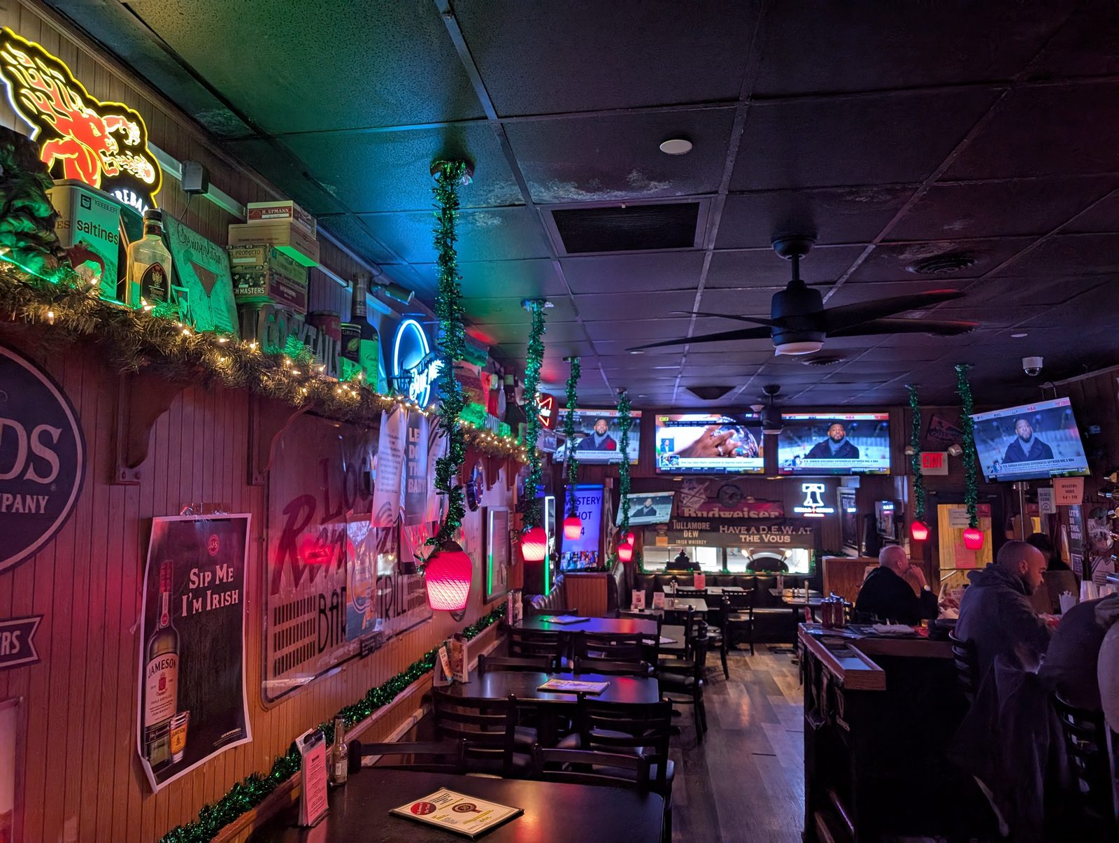 The bar and dining room at Locust Rendezvous with neon signs