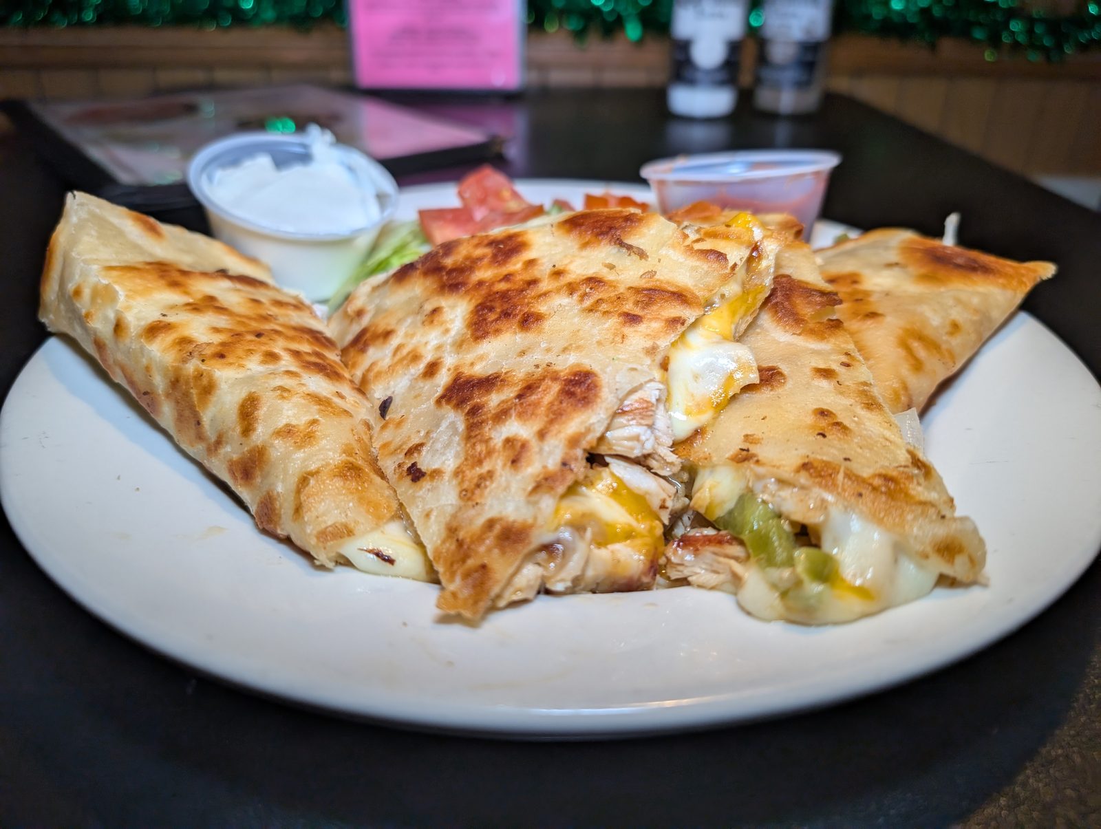 A cheese quesadilla cut into wedges