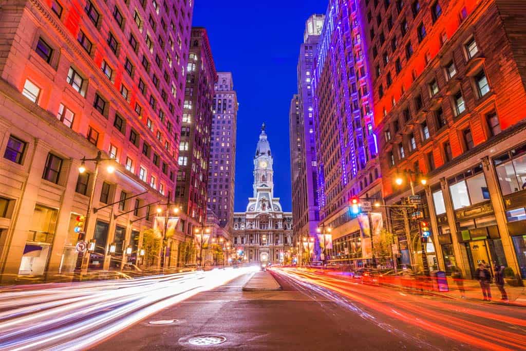 A street in Philadelphia with a historic building at the end of the street.